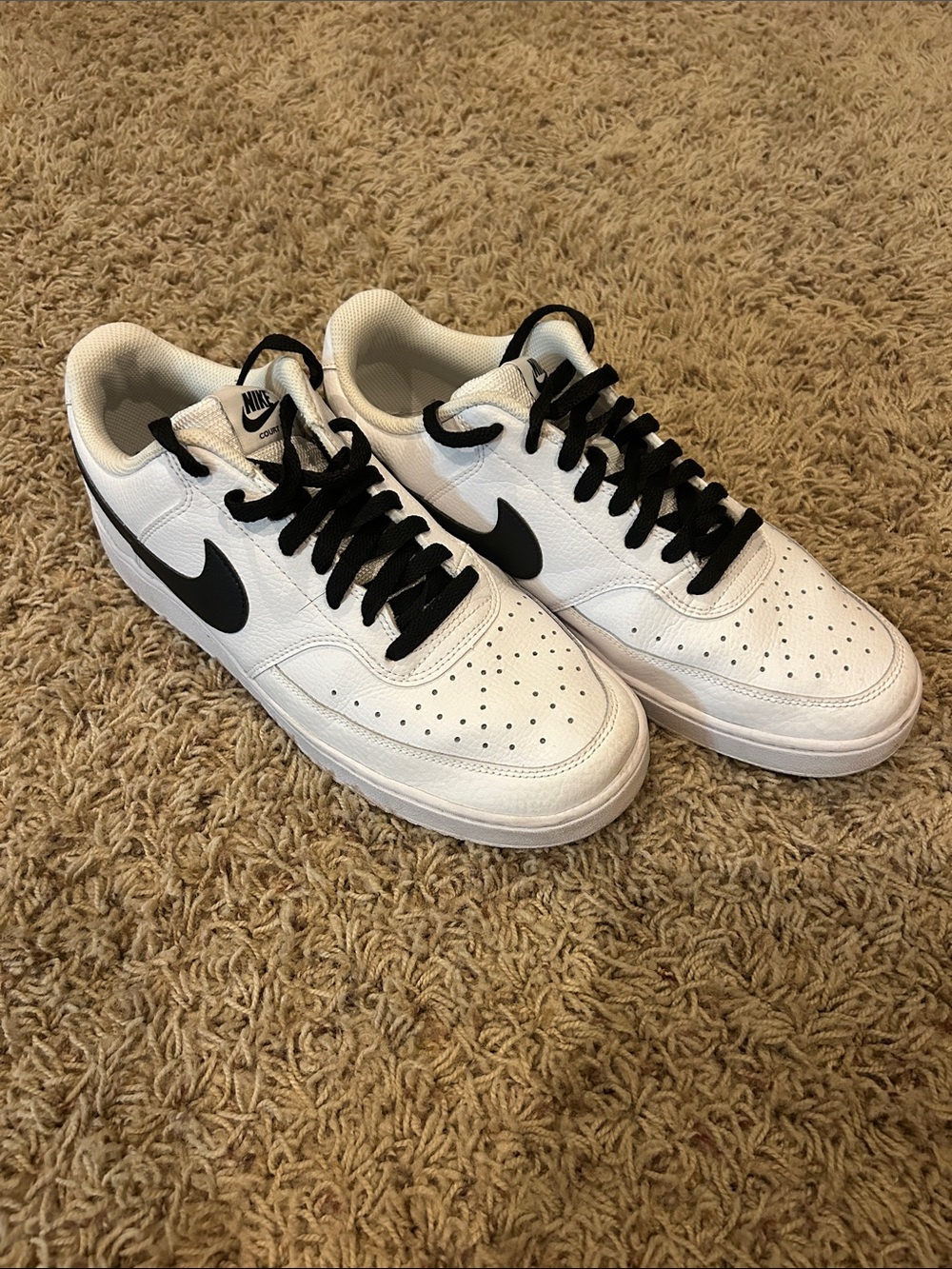 Nike White Low-Top Sneakers with Black Swoosh